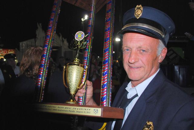 DCVFA County Convention Parade Hopewell Junction, NY - 

Pawling FD Department President Dennis Brunow with our Trophy for Best Non-Regulation Uniform - 

August 10, 2012